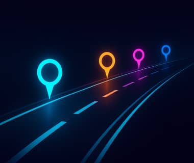 Neonfarbene Markierungen auf einer Straße symbolisieren Etappen zu einem Ziel